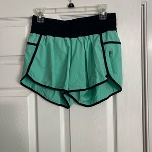 Lululemon Track That 4” short. Teal with navy. Sz 12